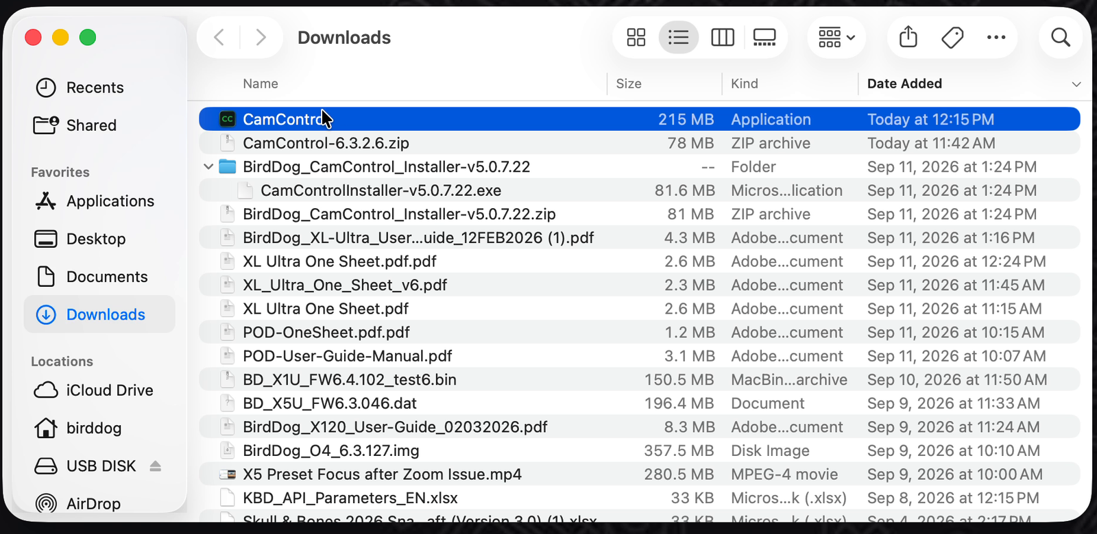Finder window showing the Downloads folder with the CamControl application selected.
